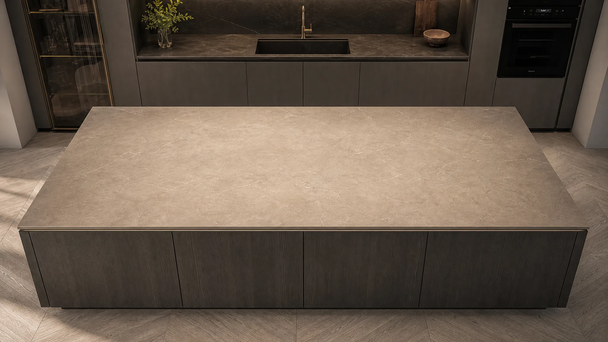AUPE invisible induction cooktop glowing beneath a dark stone kitchen island
